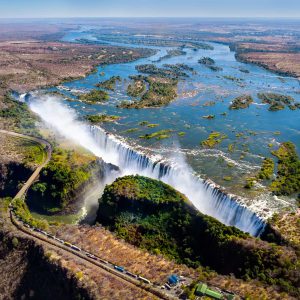 The Victoria falls is the largest curtain of water in the world (1708 m wide). The falls and the surrounding area is the National Parks and World Heritage Site (helicopter view) - Zambia, Zimbabwe